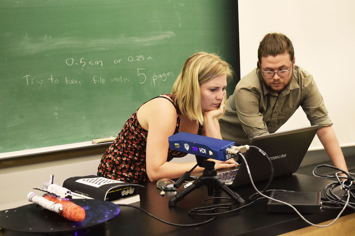 Kat and Seamus scanning the spacecraft 
