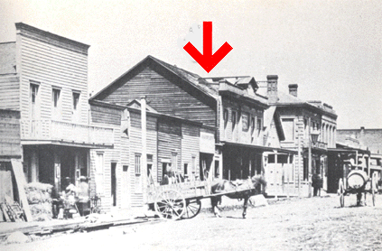 View of the Victoria Theatre with red arrow.  B.C. Archives,	Looking North Along Government Street from Fort St., Victoria,	Call # A-0321